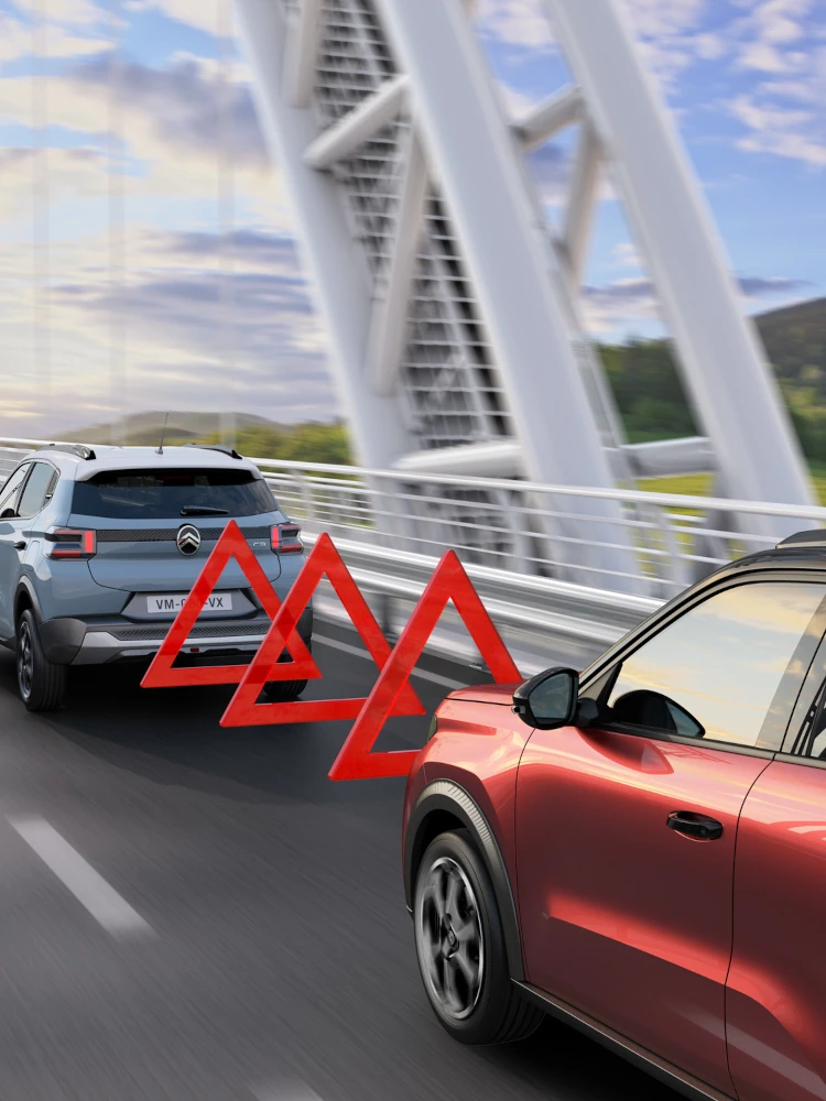 Rear driving view of Citroën C3 compact SUV illustrating forward collision alert for safer, confident and affordable everyday urban mobility.