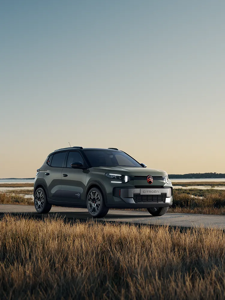 Front three-quarter view Citroën C3 Outdoor with LED signature shows Advanced Comfort SUV by coastal wetlands