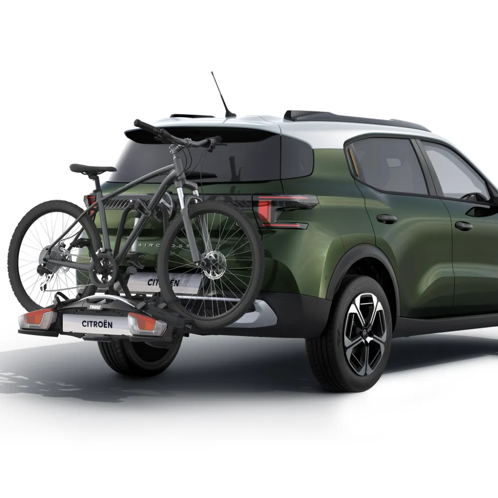 Rear view of Citroën ë‑C3 Aircross electric SUV with bicycle carrier showing easy bike transport for versatile, affordable mobility.
