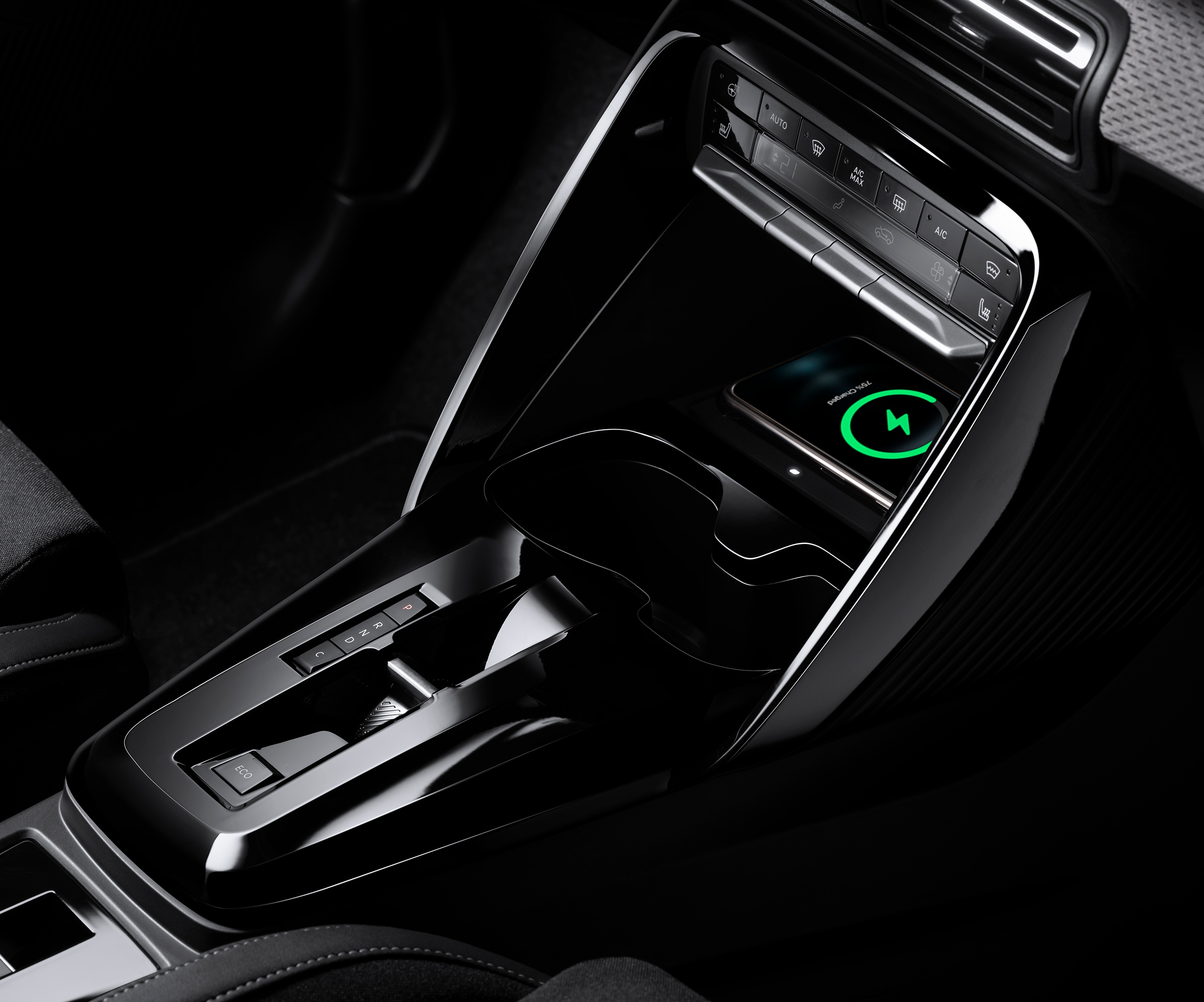 Close‑up console view of Citroën C3 SUV highlighting wireless charging for practical, affordable everyday mobility.