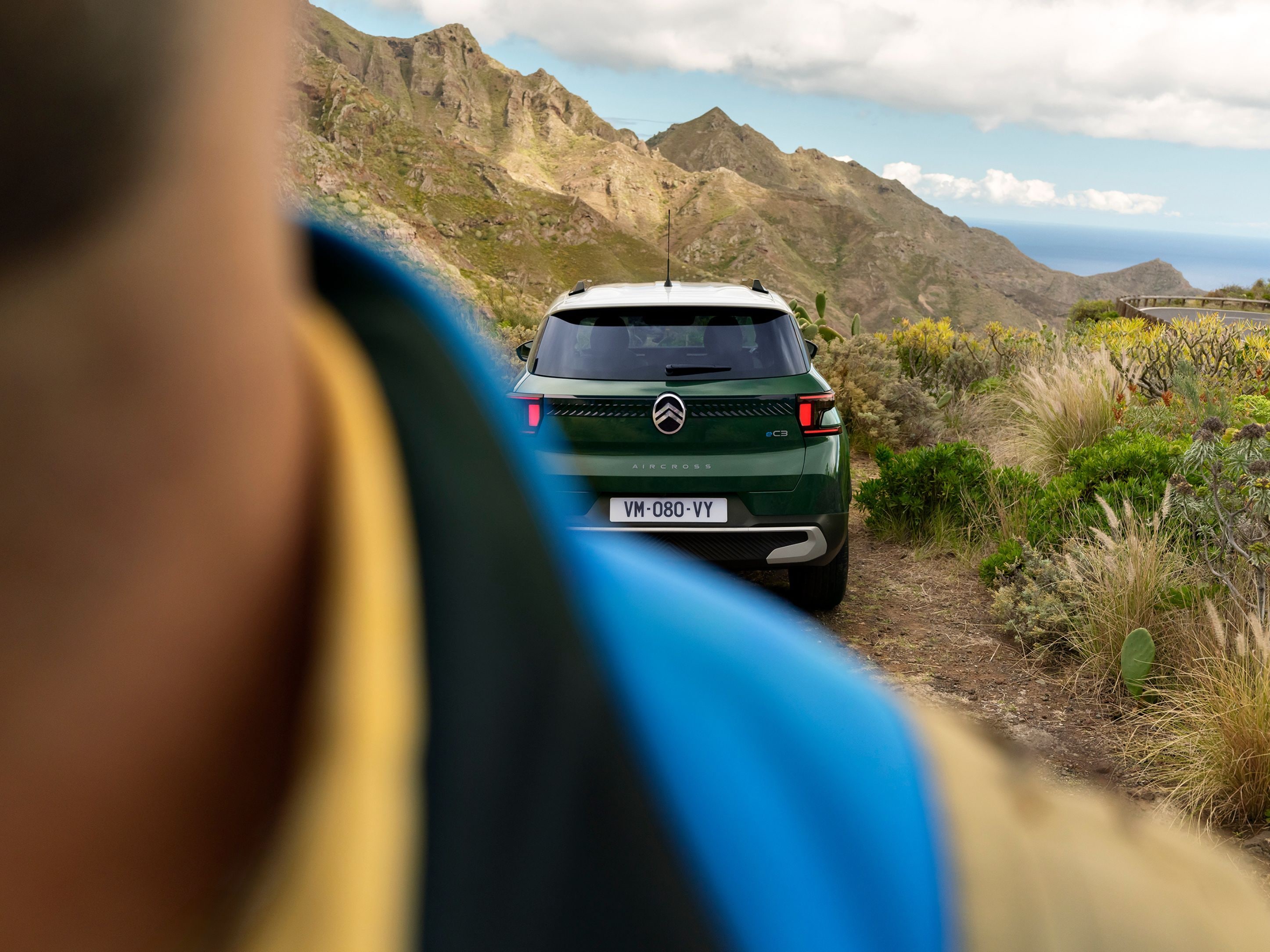 Rear outdoor view of Citroën ë-C3 Aircross SUV highlighting rugged styling for confident, versatile and affordable off‑road mobility.