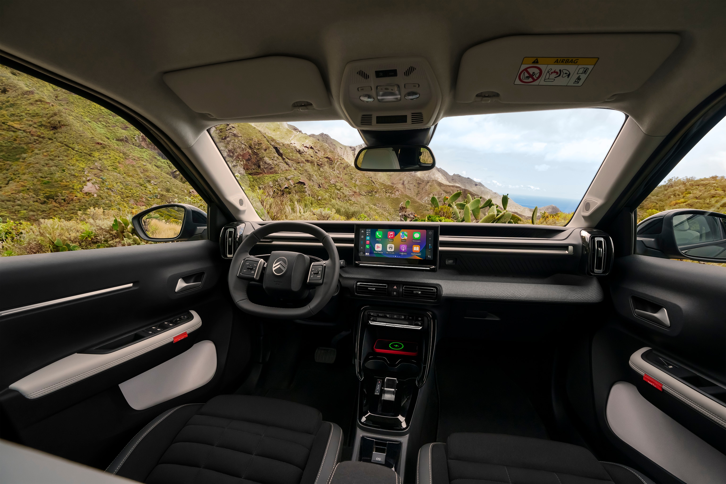 Front interior view of Citroën ë-C3 Aircross SUV showcasing panoramic dashboard and large touchscreen for intuitive, spacious and affordable everyday driving.