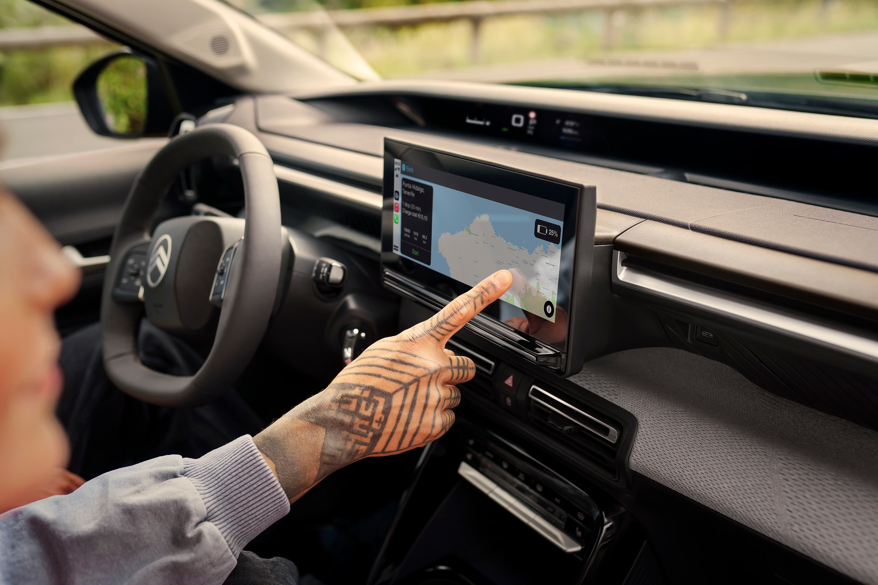 Interior touchscreen view of Citroën ë-C3 Aircross SUV showing navigation system for intuitive, connected and affordable everyday driving.
