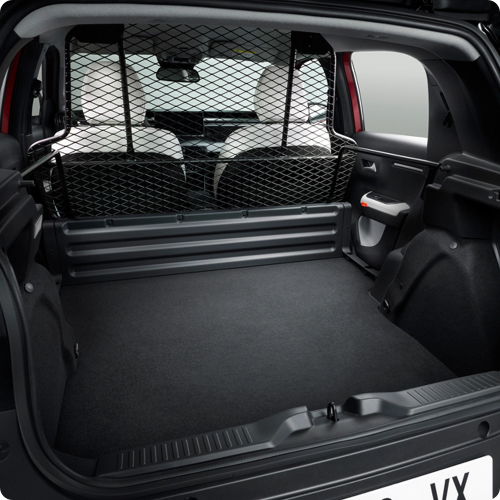 Rear cargo area view of the Citroën ë-C3 Van, highlighting the spacious load compartment, protective bulkhead partition and practical storage capacity.
