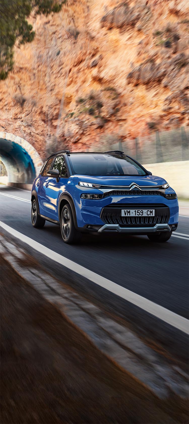 C3 Aircross SUV driving on a country road
