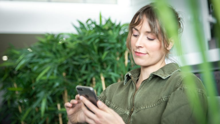 Woman looking at mobile telephone